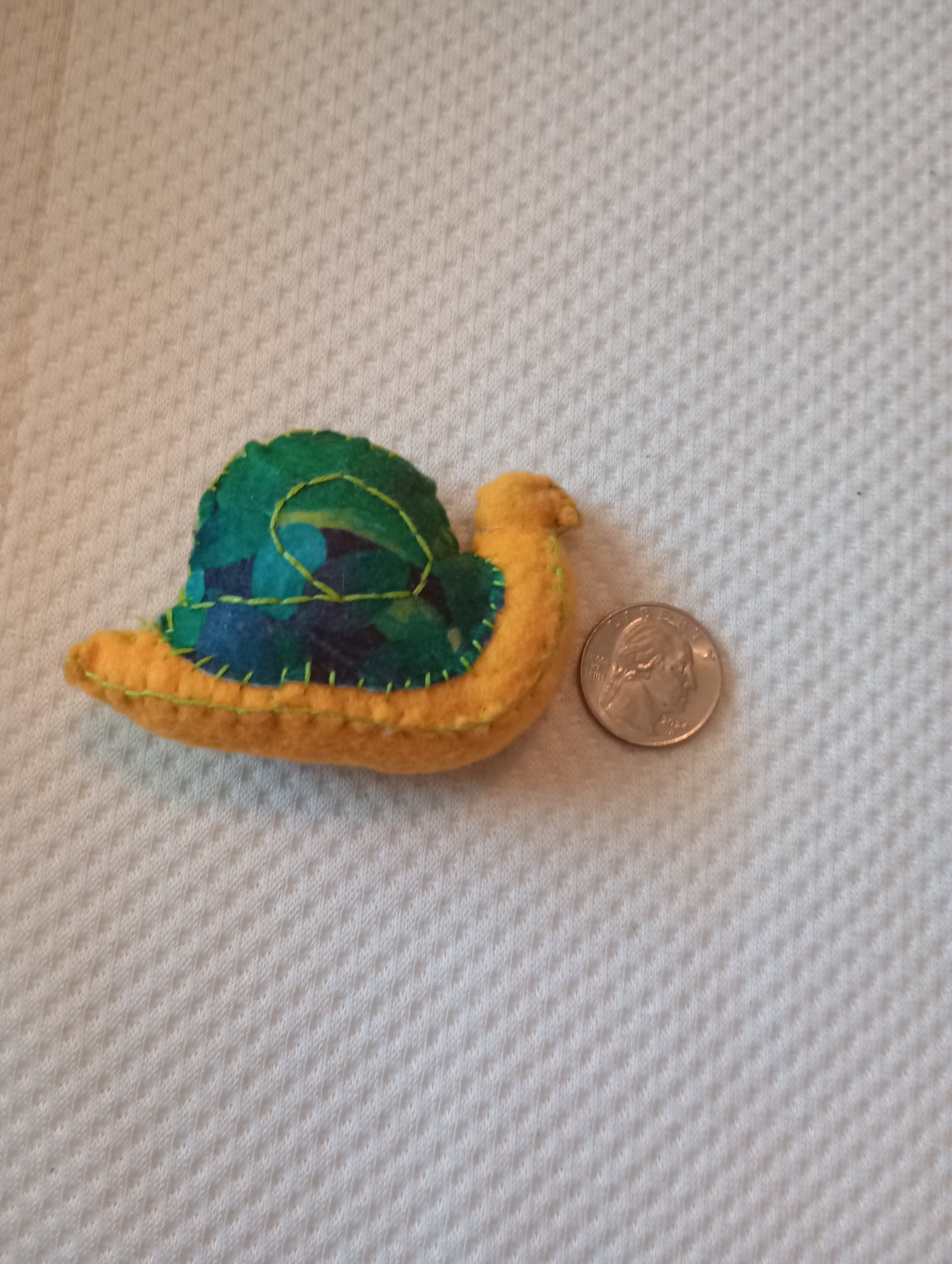 Leafy snail guy, crystal: pyrite