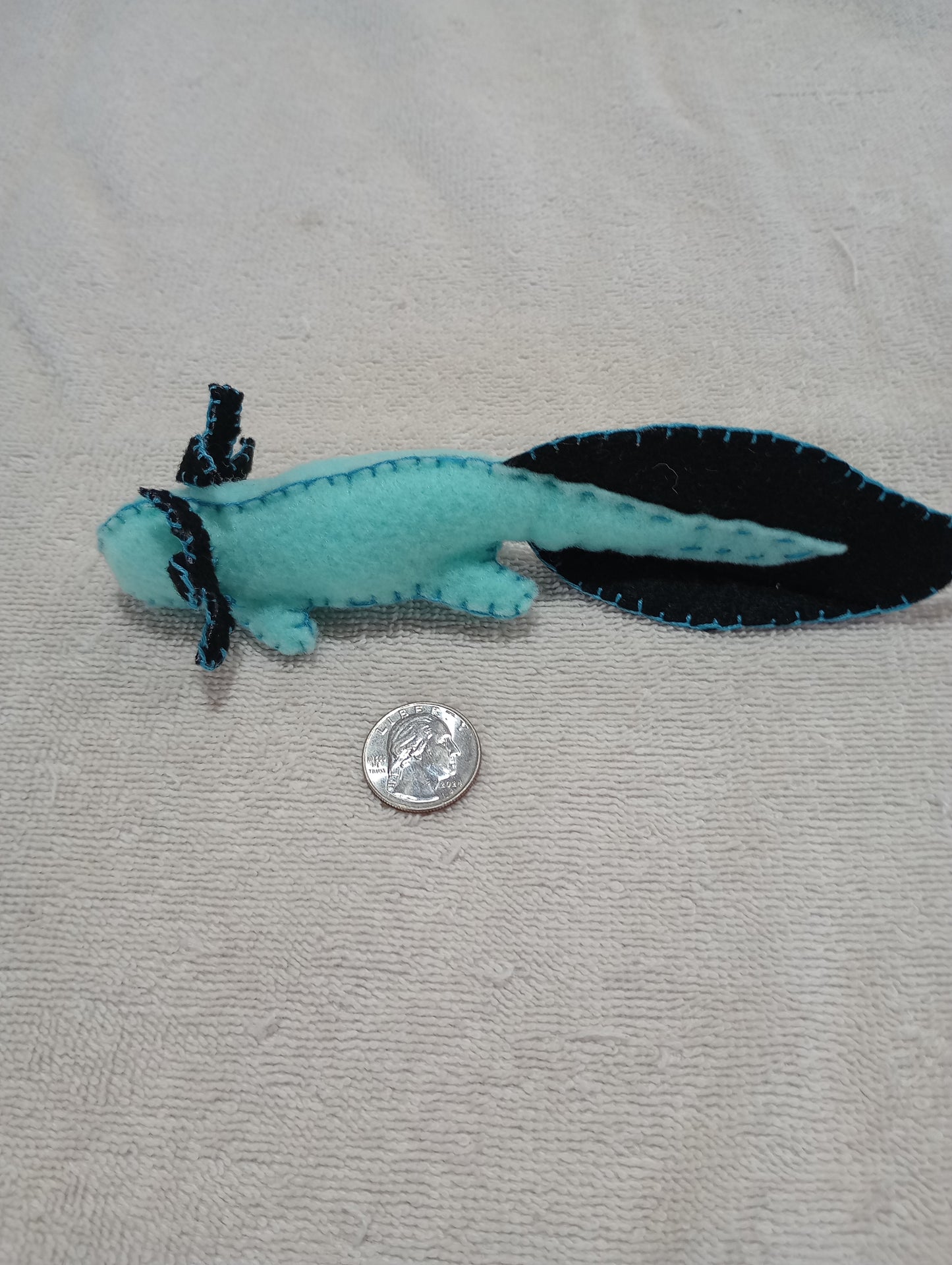Blue and black axolotl guy crystal: random