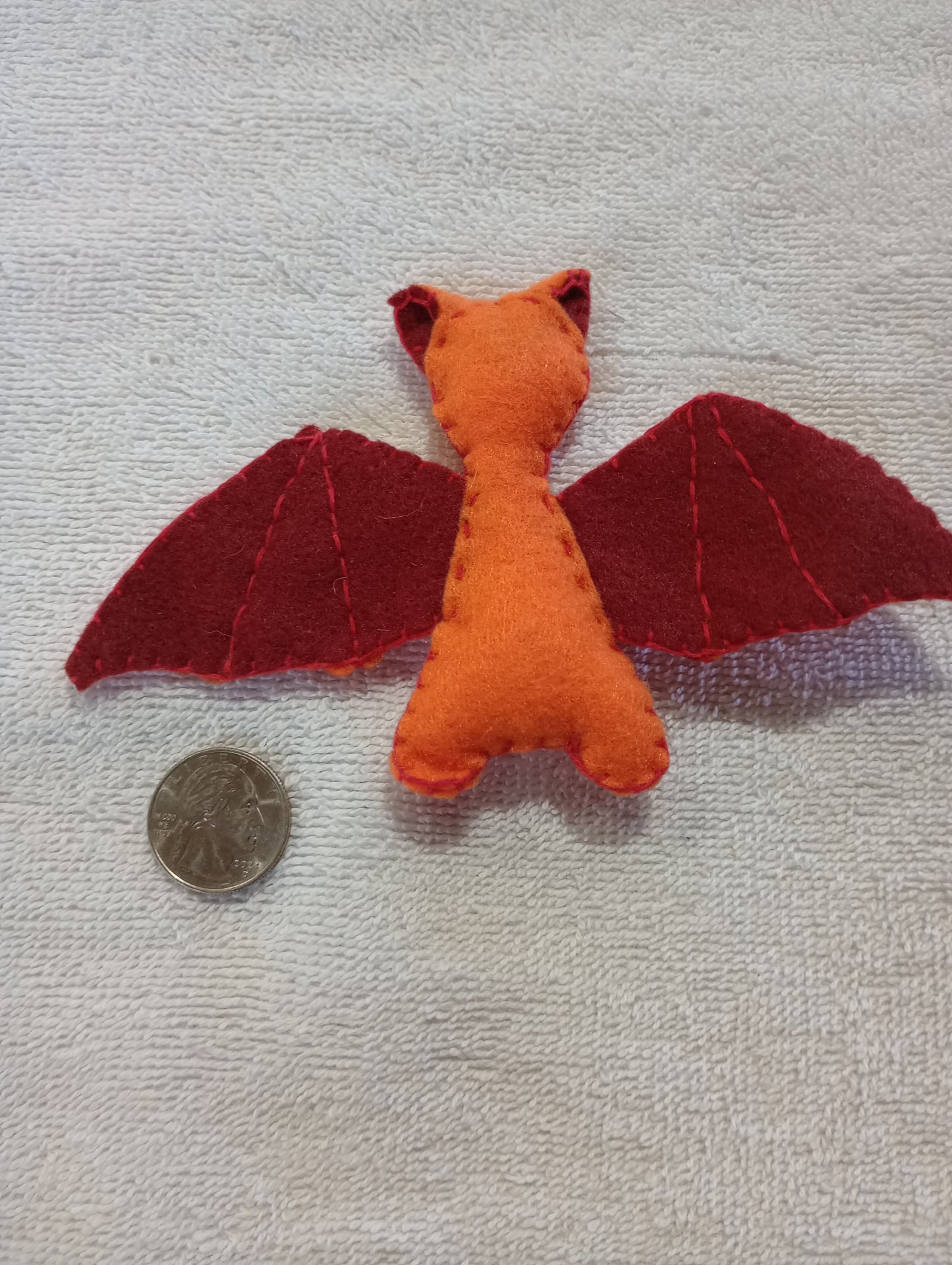 Orange and red bat guy crystal: random