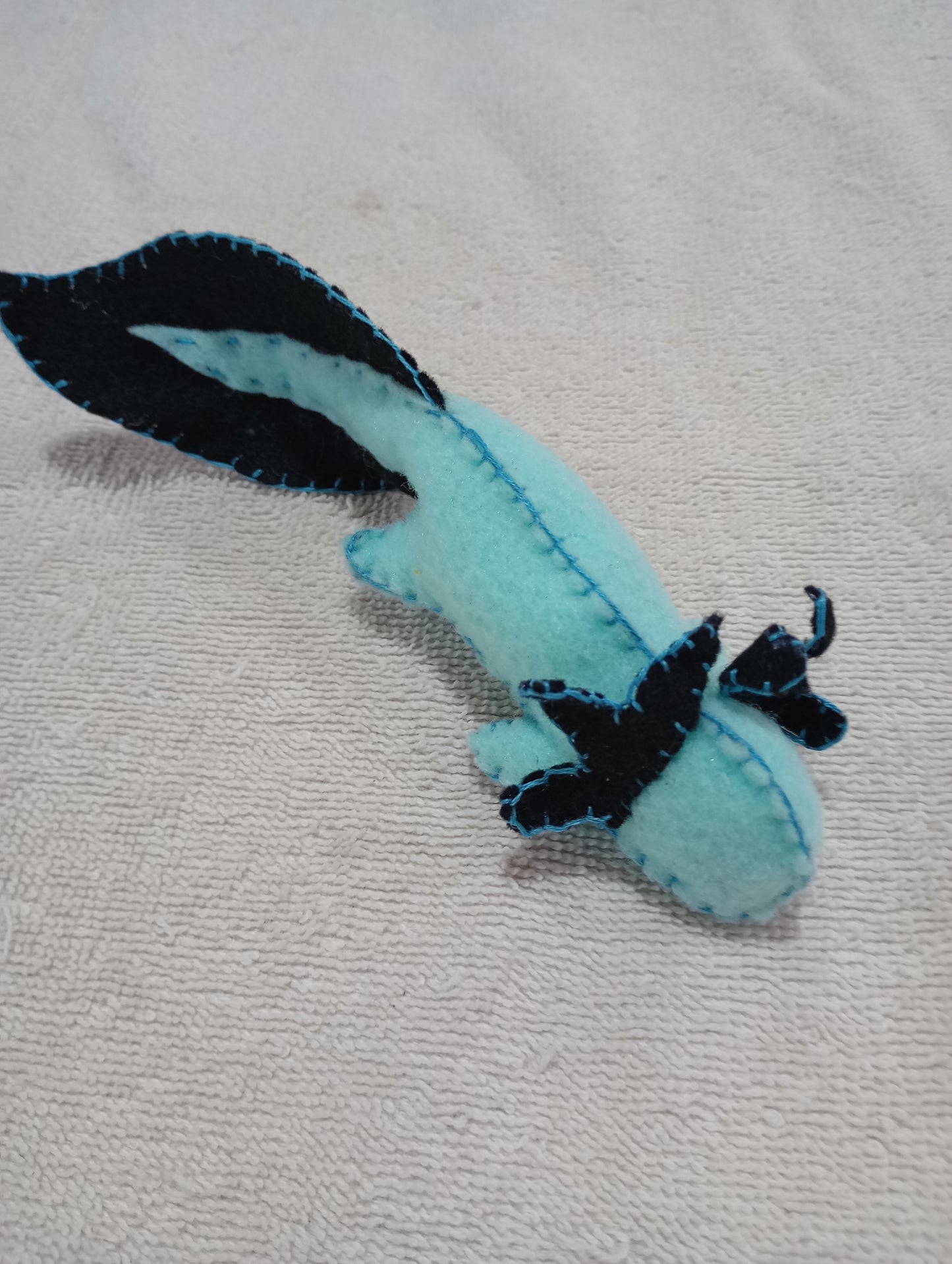Blue and black axolotl guy crystal: random