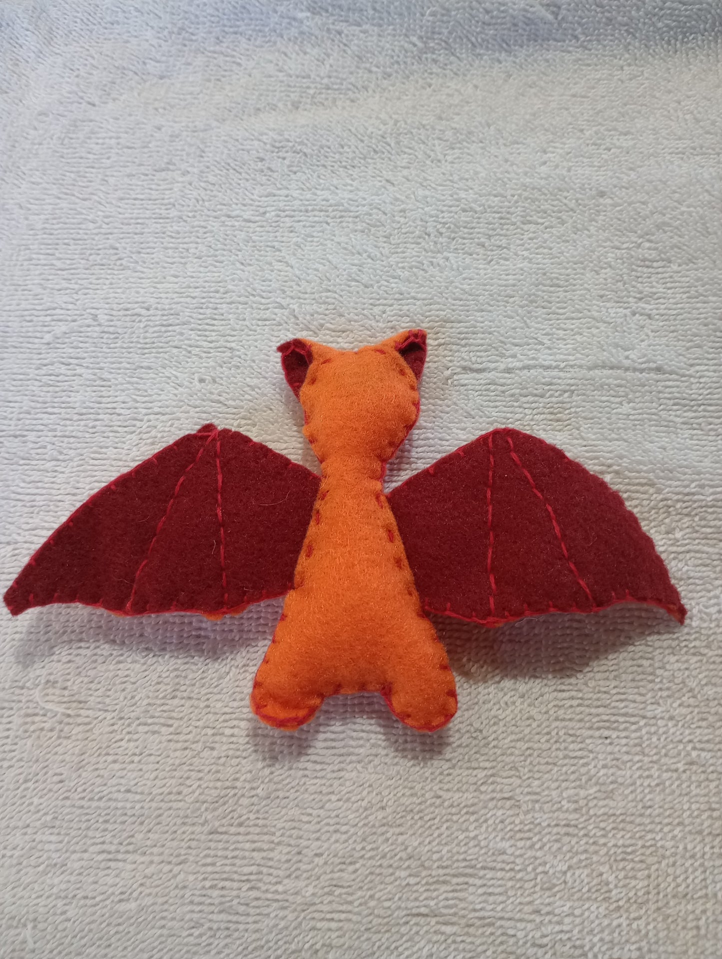 Orange and red bat guy crystal: random