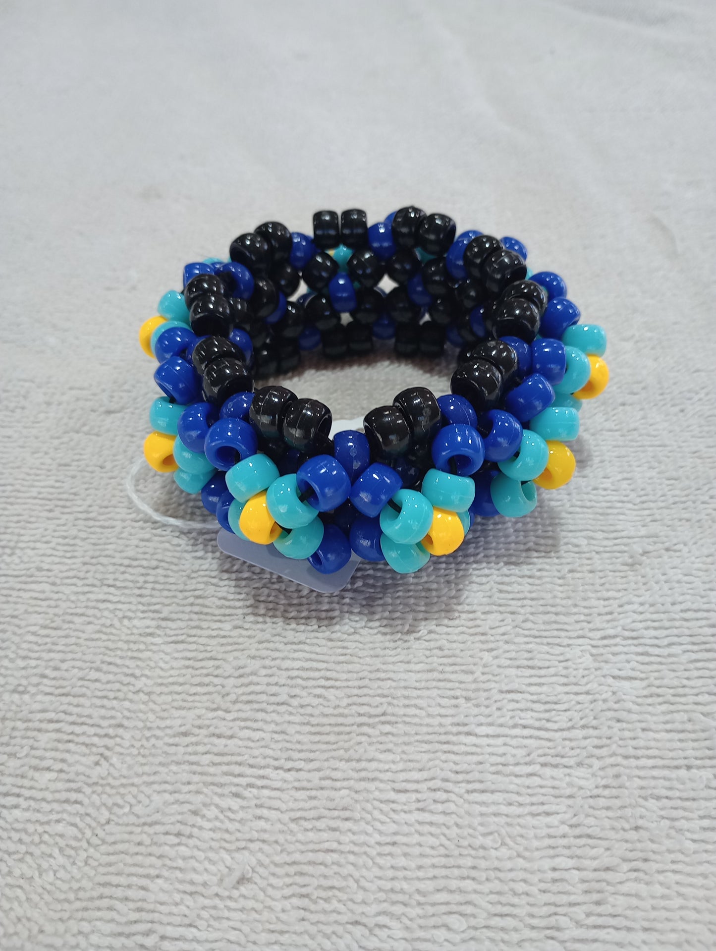 Blue and yellow UFO cuff