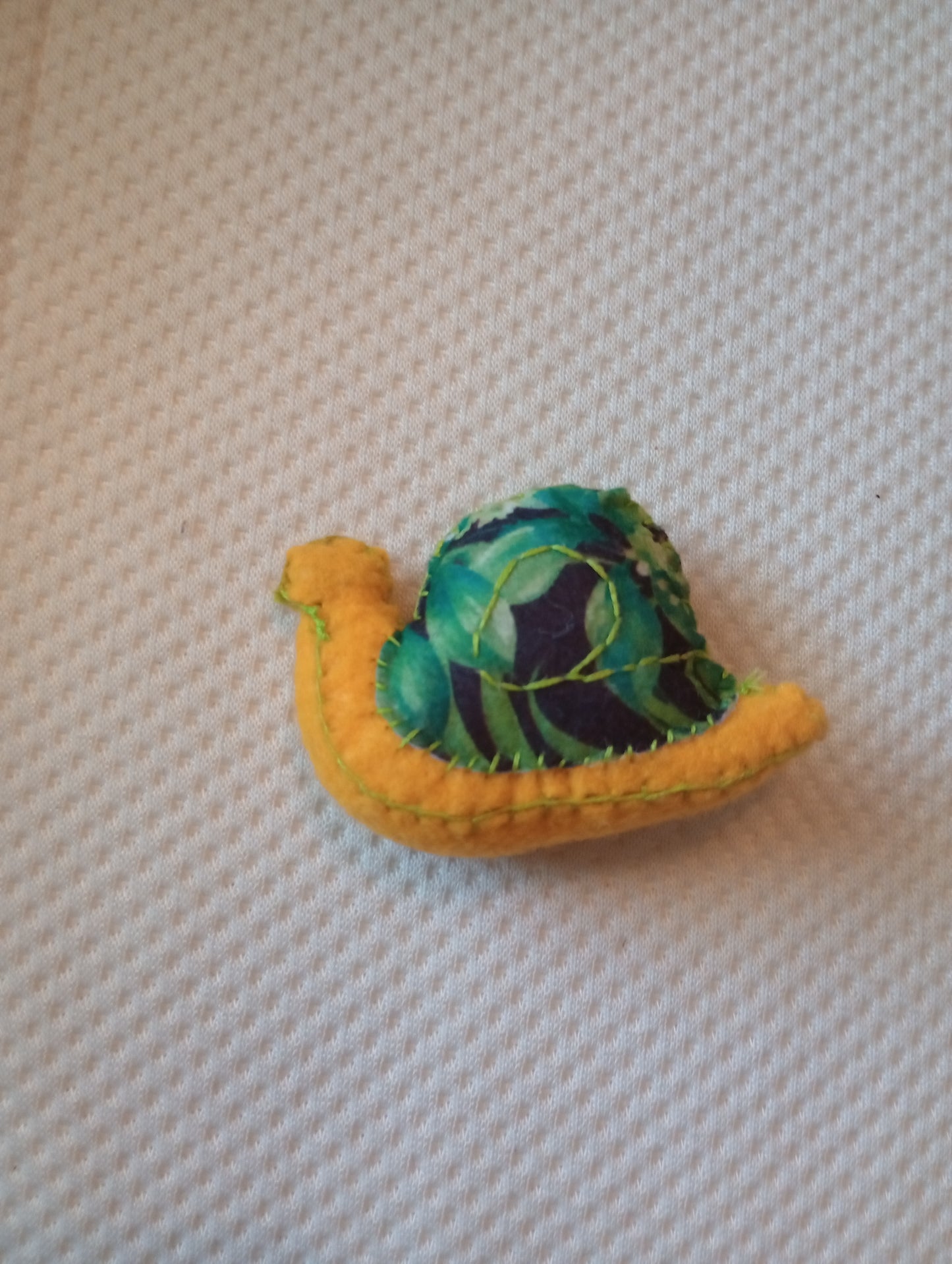 Leafy snail guy, crystal: pyrite